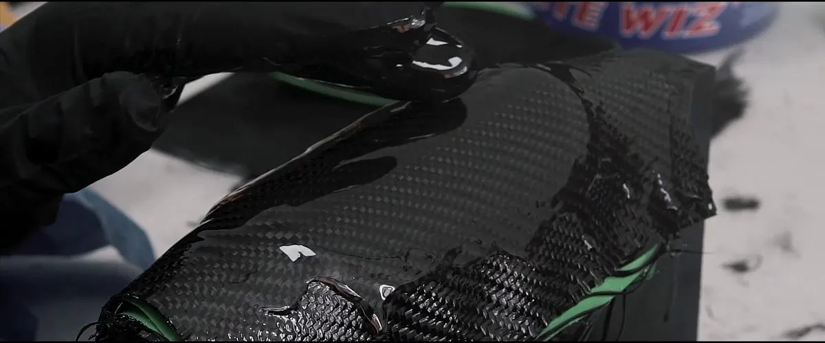 Laminating the carbon fibre of the shin guard
