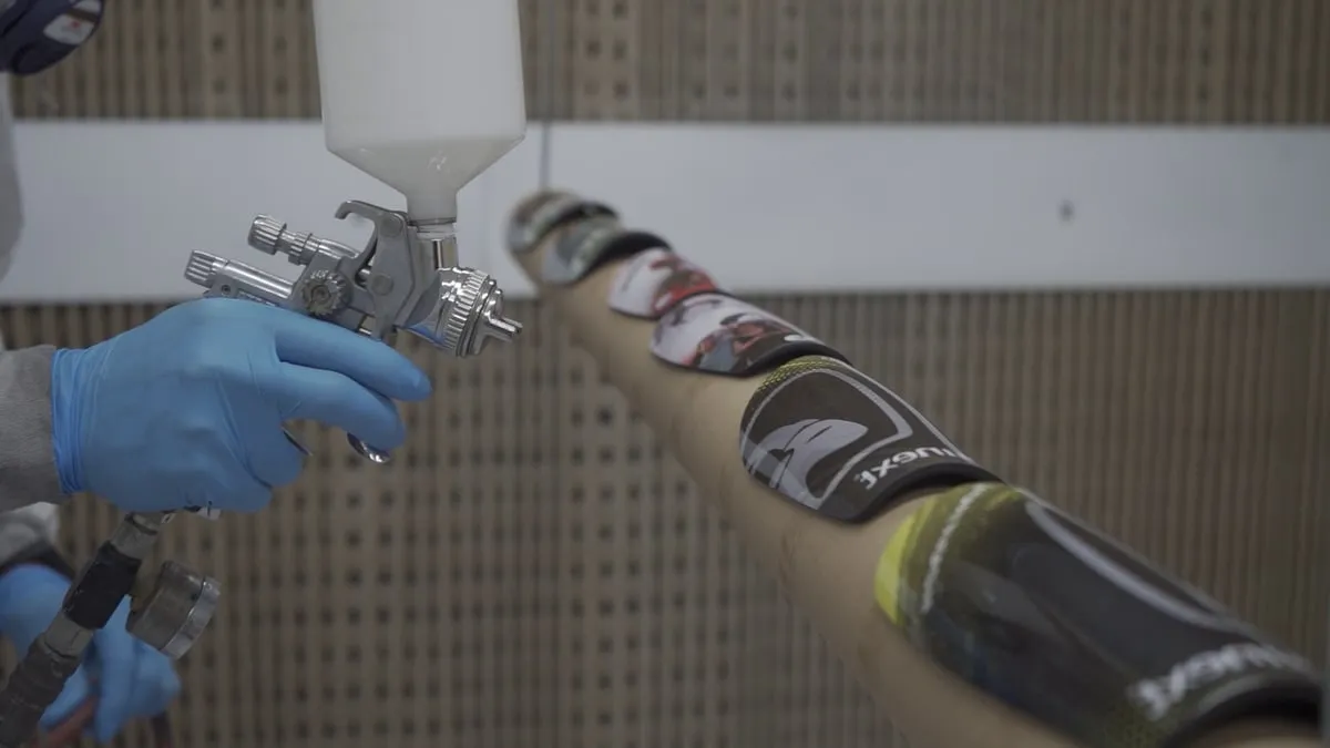 Customisation and finishing of the shin guards in the booth
